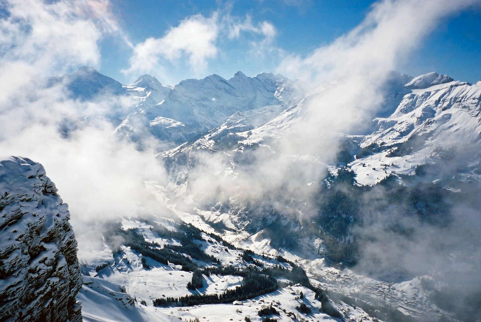 Snow and cloud over the peaks above the Lauterbrunnen valley in Switzerland